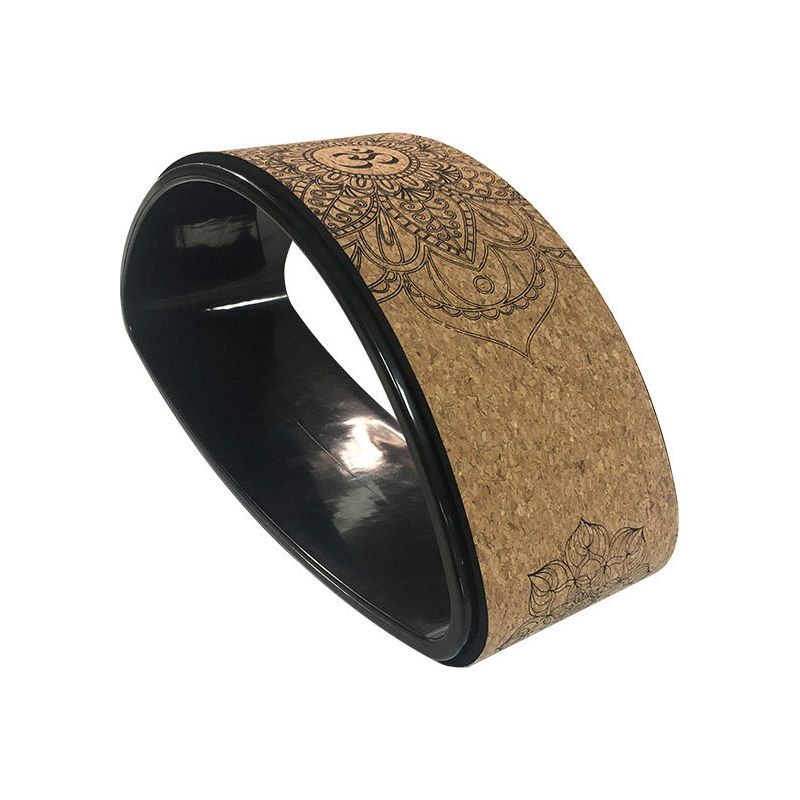 Cork yoga wheel with a textured surface for balance and flexibility exercises.