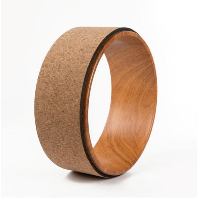 Cork yoga wheel with wood-grain pattern.